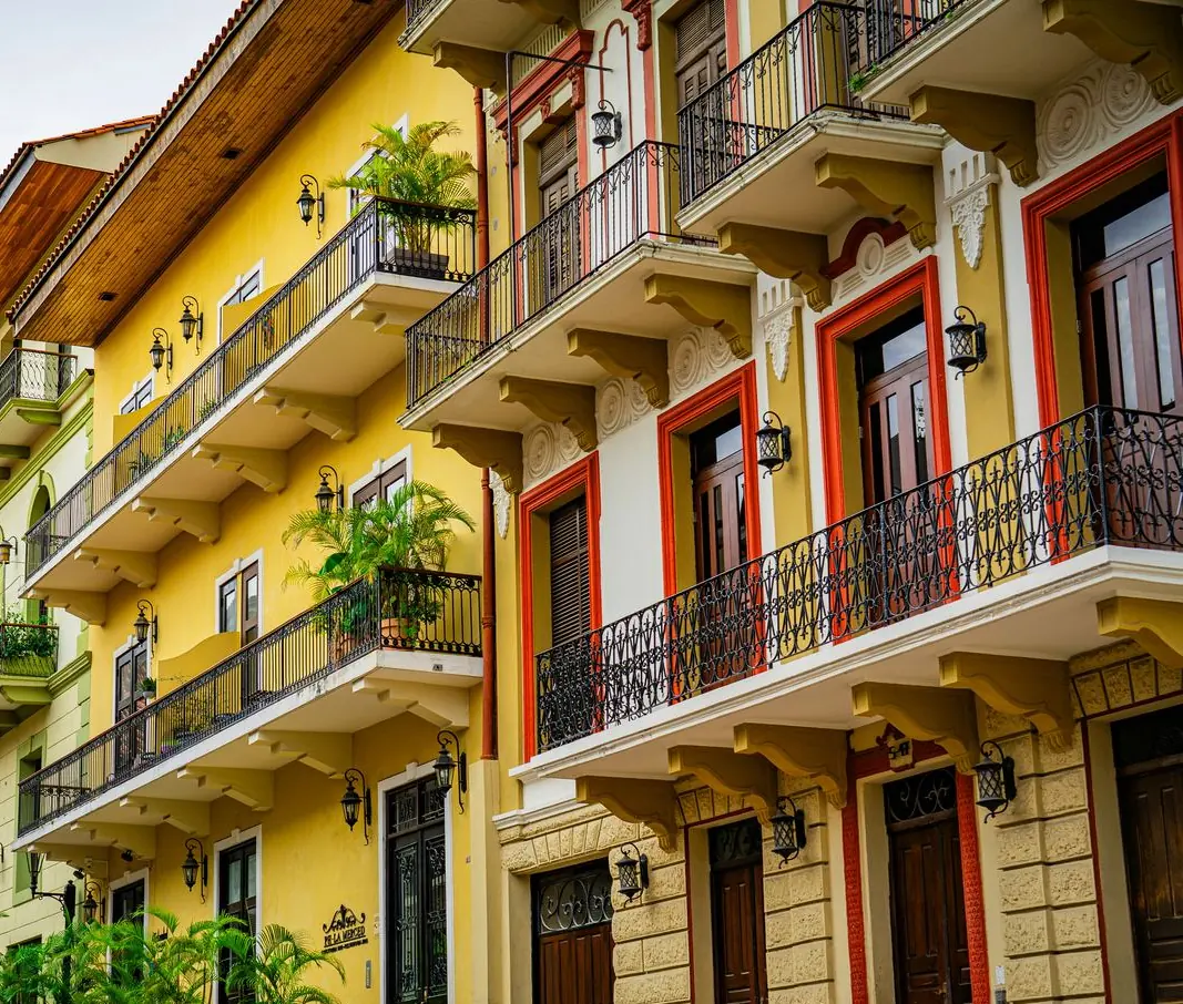 Restored colonial mansion with wrought-iron balconies