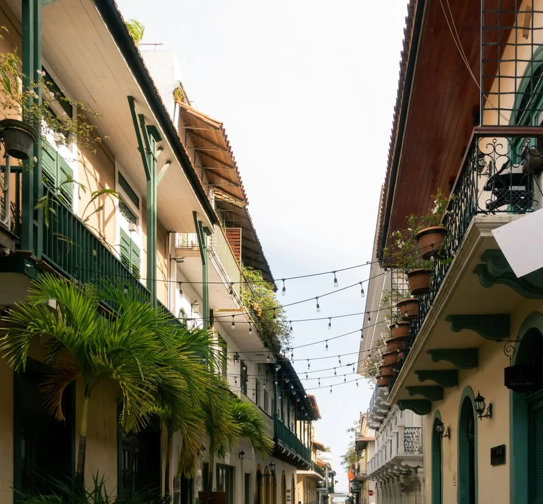 Colonial lane with green shutters near guesthouses
